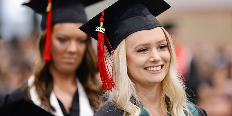 girls wearing graduation cap and tassel